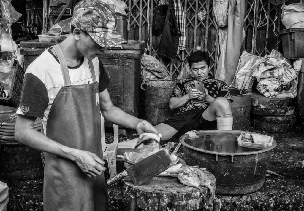 Fishmongers at Khlong Thoey Market, Bangkok