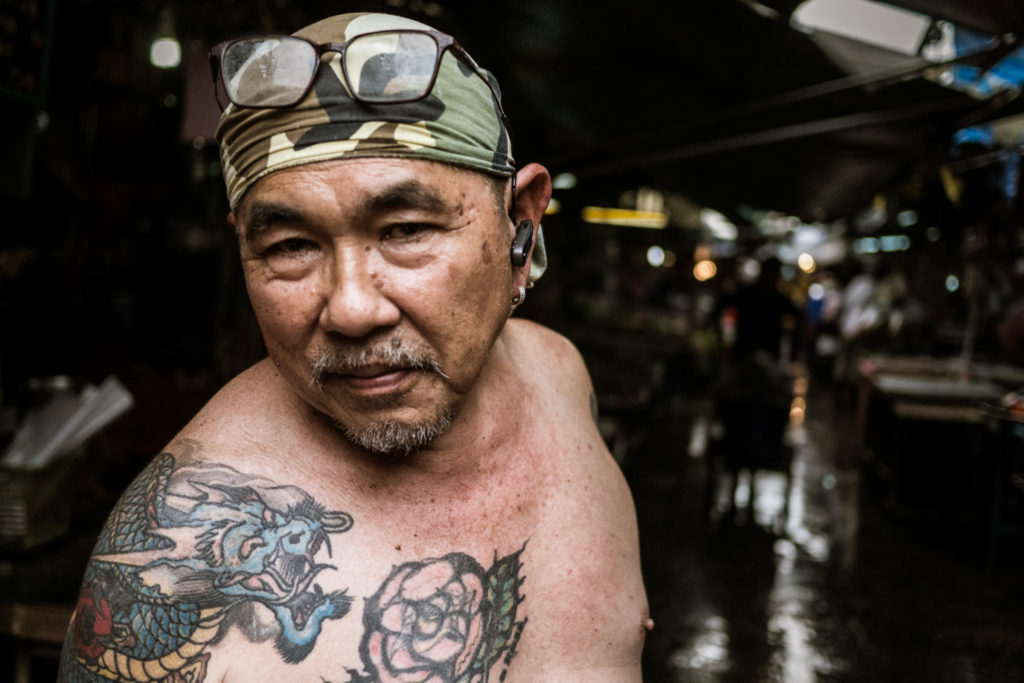 Fishmonger at Khlong Thoey Market, Bangkok